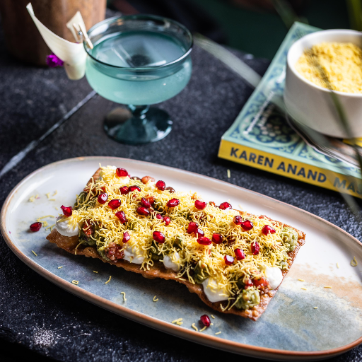 Avocado Sev Puri served with a garnish of sev and lime at Tattva Bar and Café