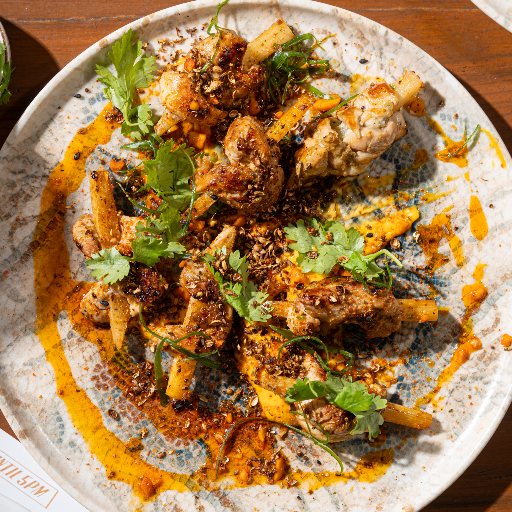 Perfectly grilled chicken skewers with a golden char served at Tattva Bar and Café.